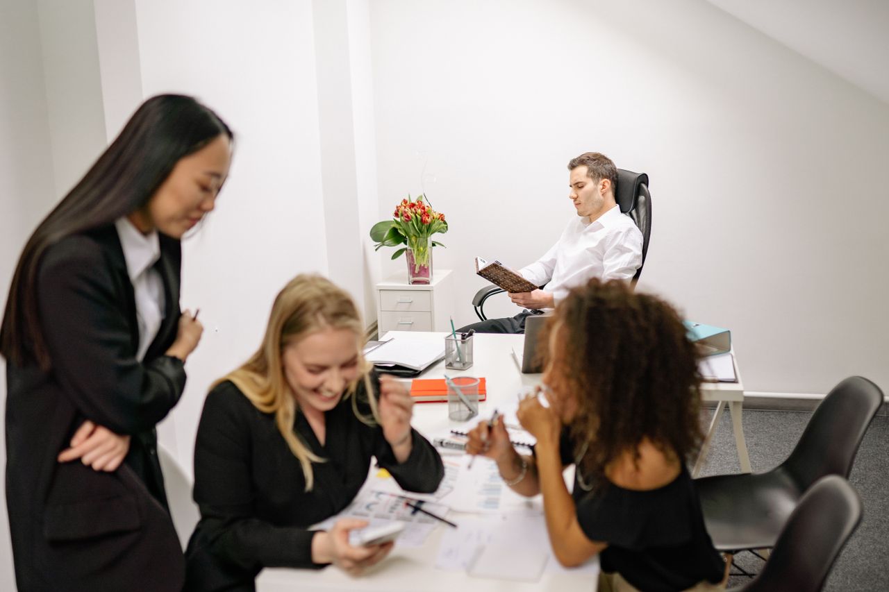 A diverse group of professionals collaborating in a modern office environment.